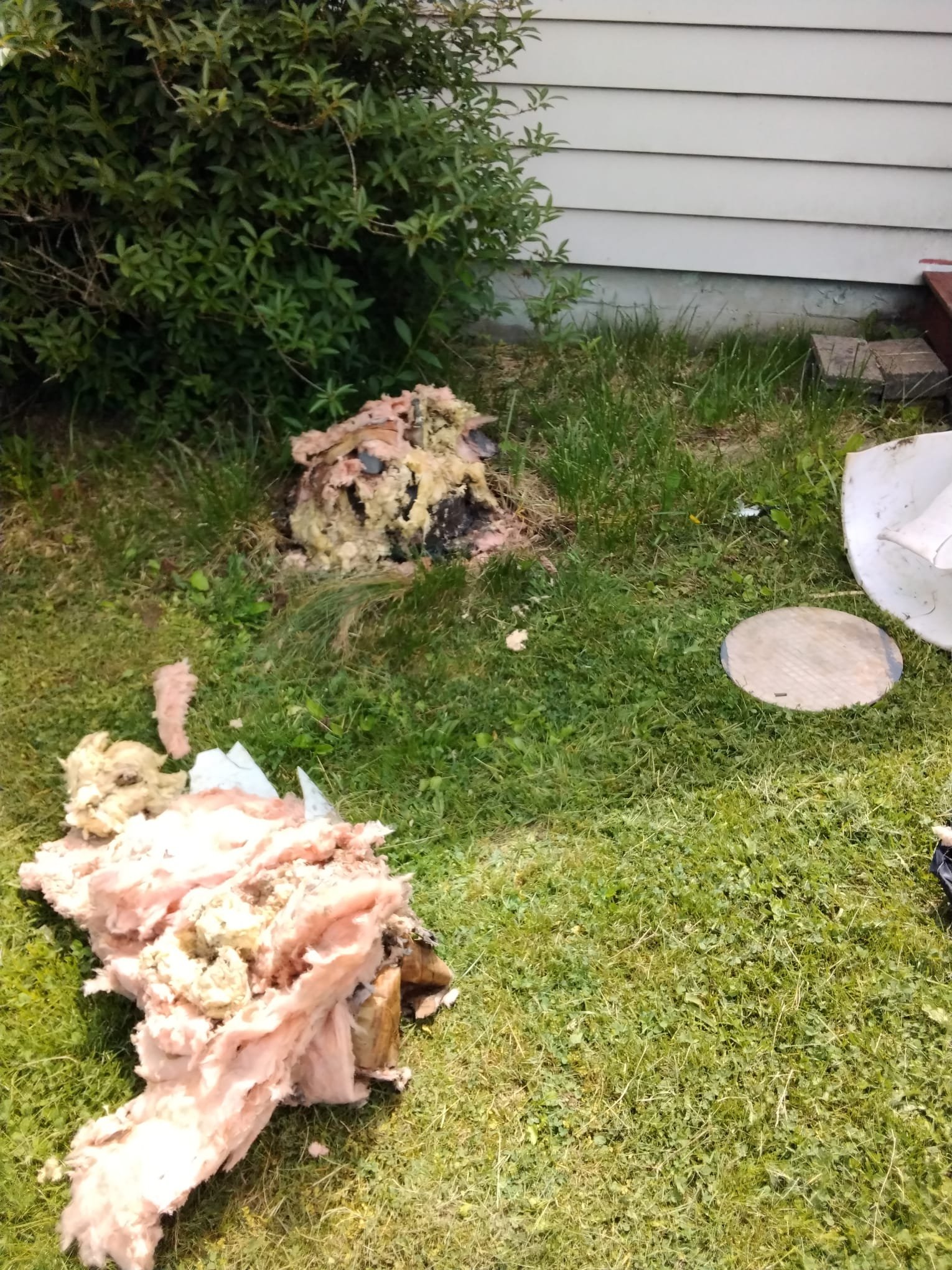 Before repair state: The area with exposed insulation and protective cover, making access to the well challenging