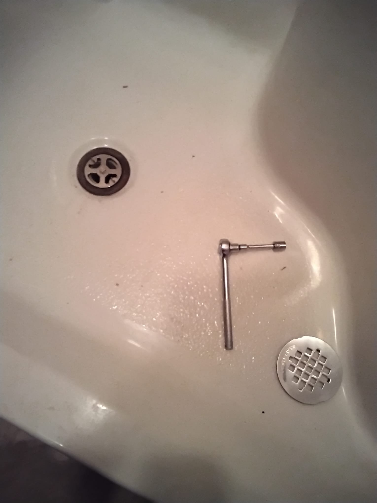 Newly installed shower drain kit displayed on a clean sink surface