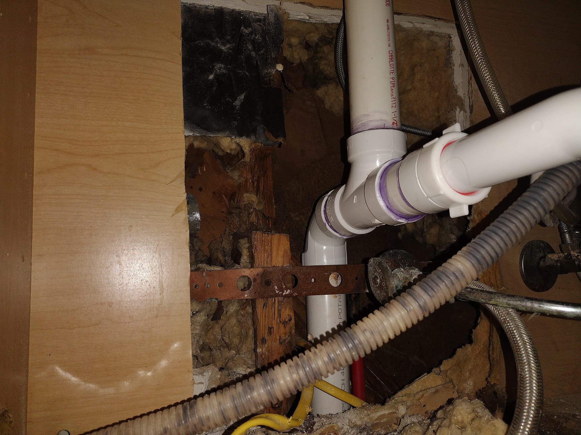 Newly installed PVC piping within a wall