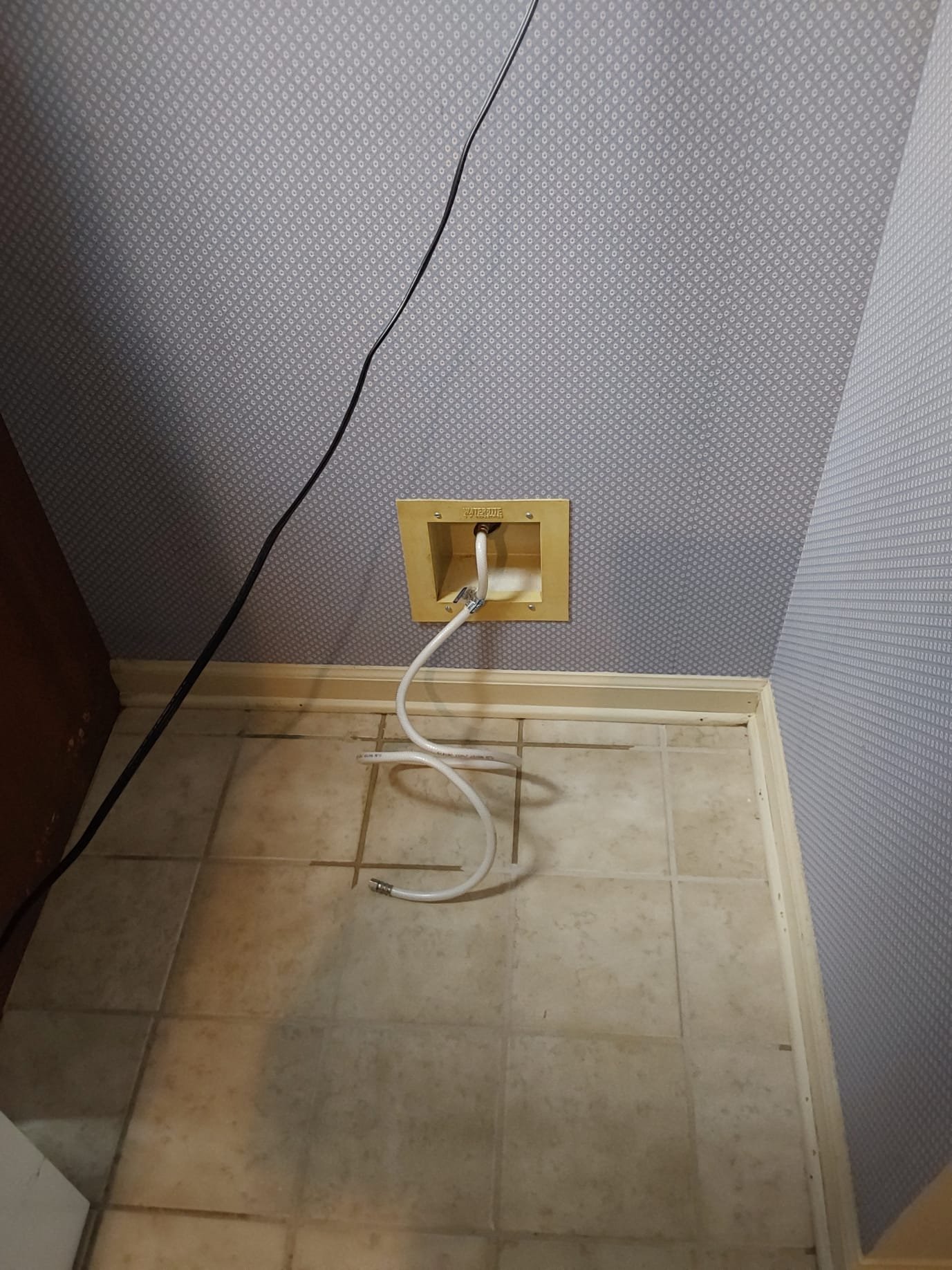 Before Repair – A glimpse of the plumbing area with disconnected hoses