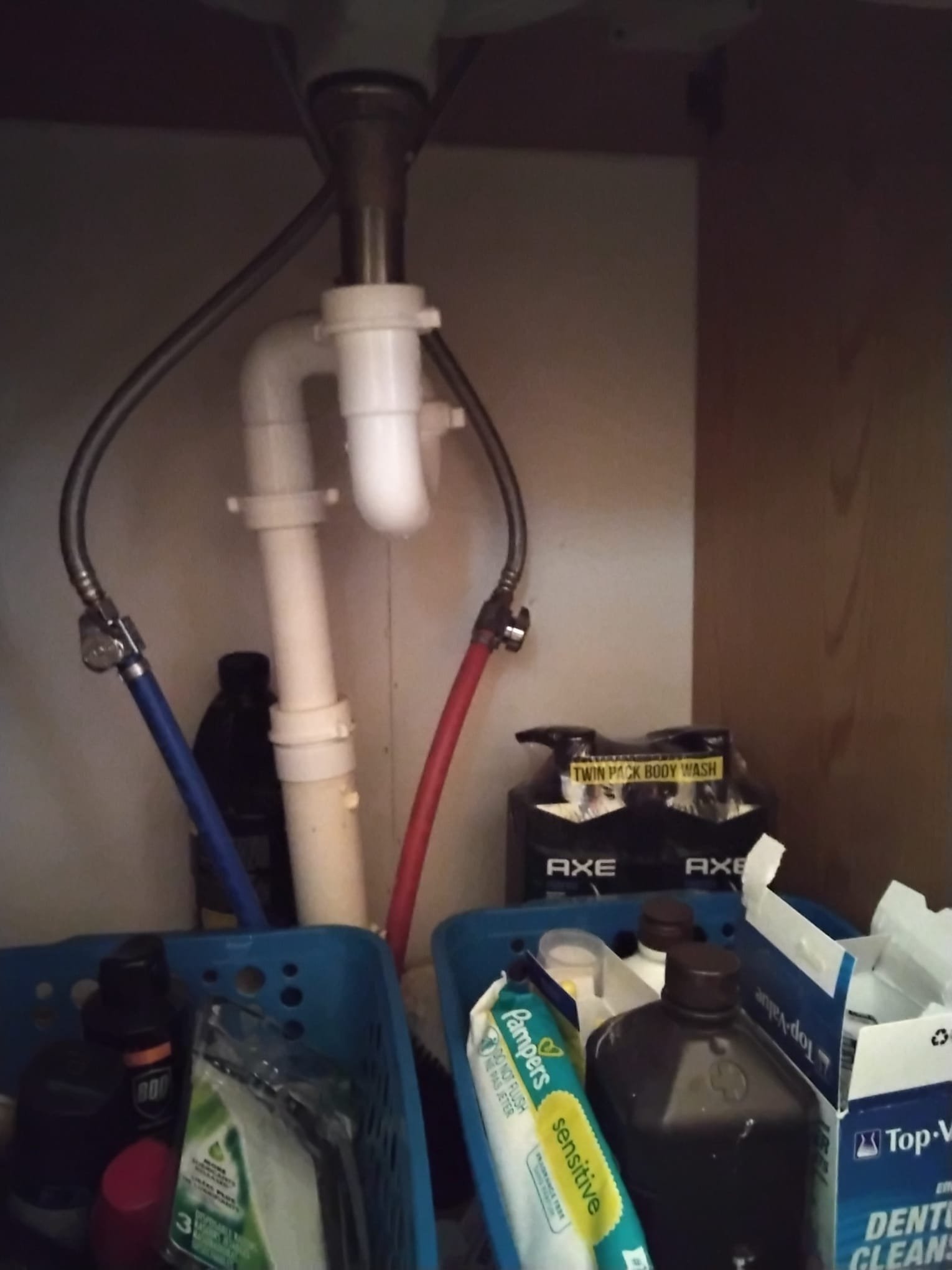 Well-maintained under-sink plumbing: Tight connections and clean fittings demonstrate the benefits of a professional installation.