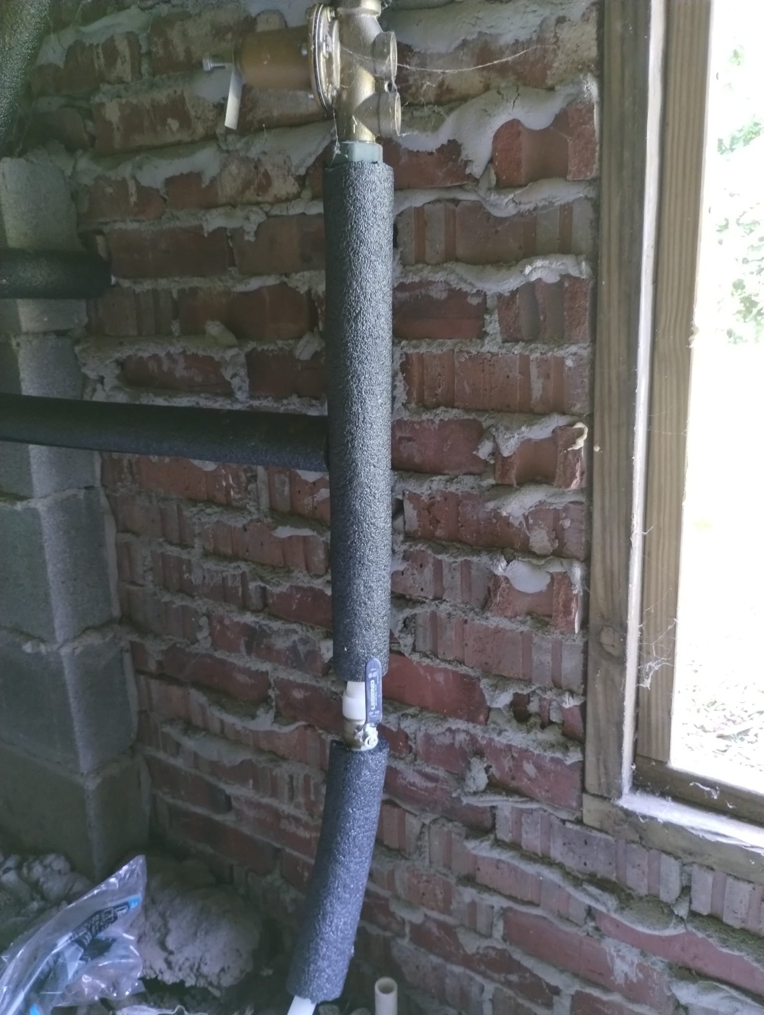 Finished water line installation with a neatly restored yard