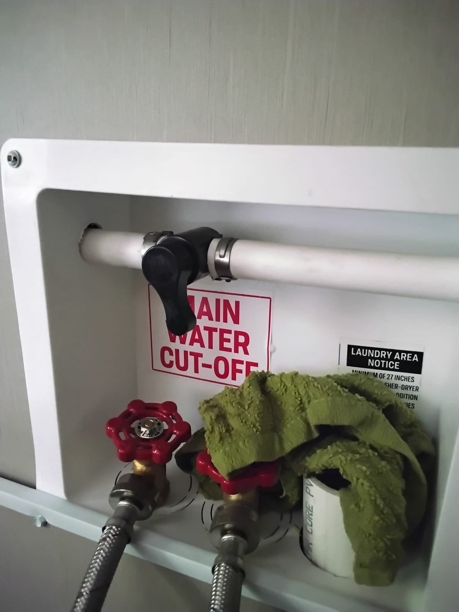 Newly installed water control valve with clear labeling indicating its function, ensuring ease of use in emergencies.