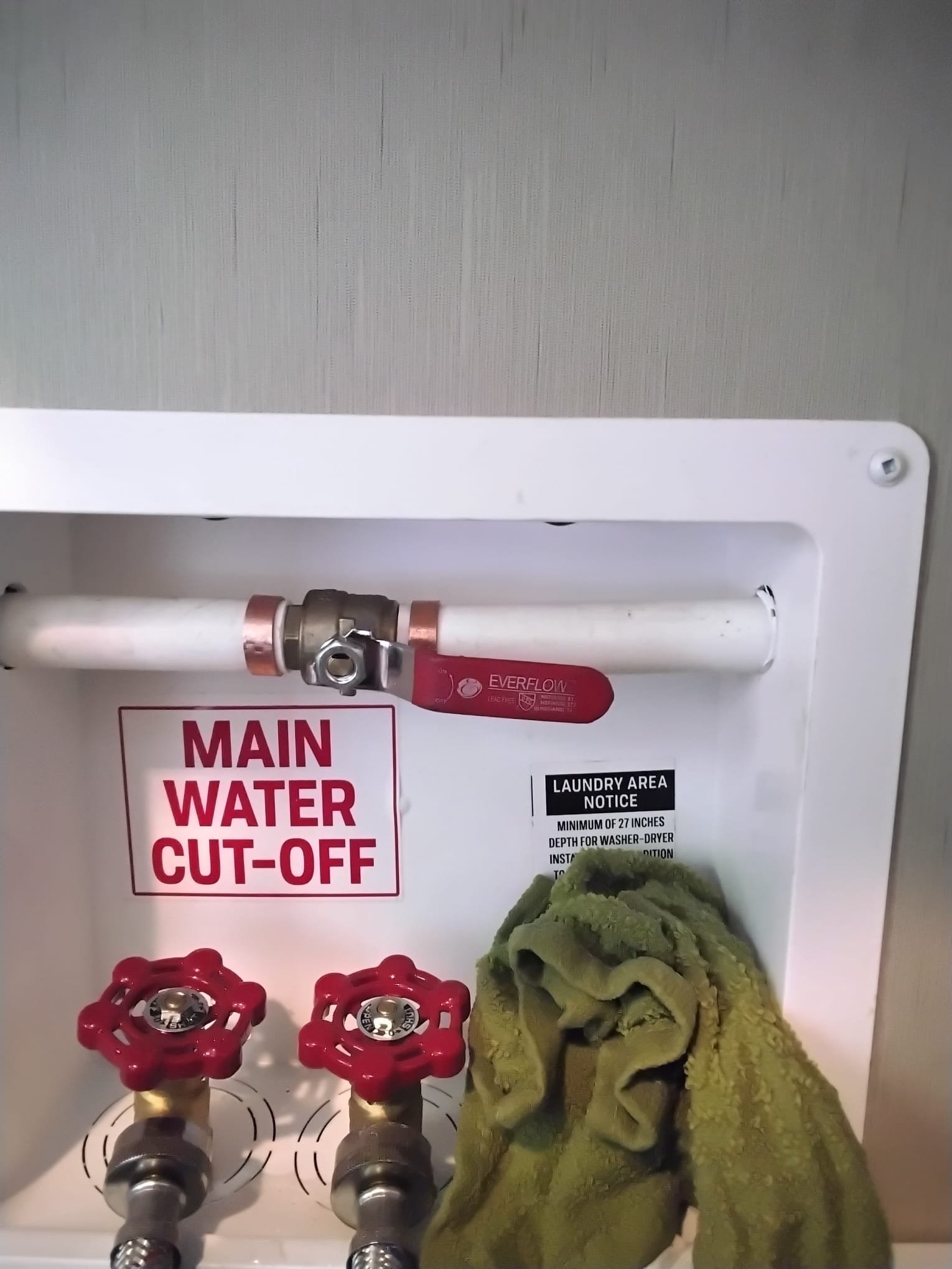 A modern plumbing setup after maintenance, featuring a prominently installed water control valve and supporting equipment that highlights the benefits of a new installation.