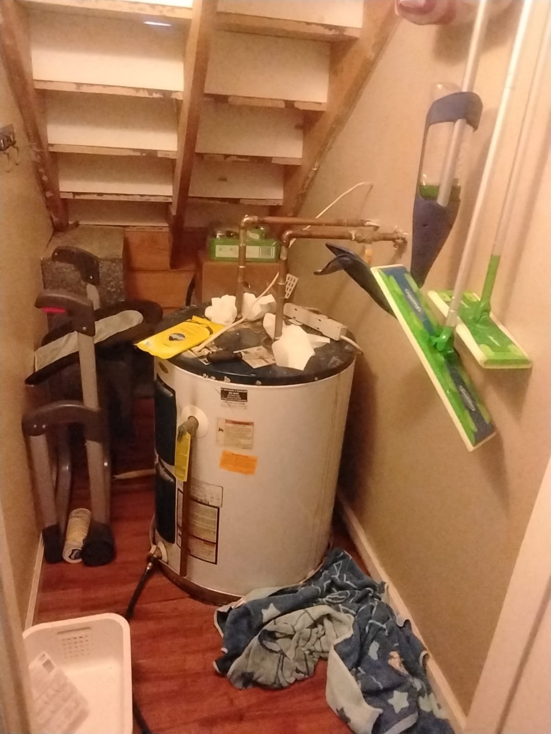Old Lowboy Water Heater in a Cluttered Space