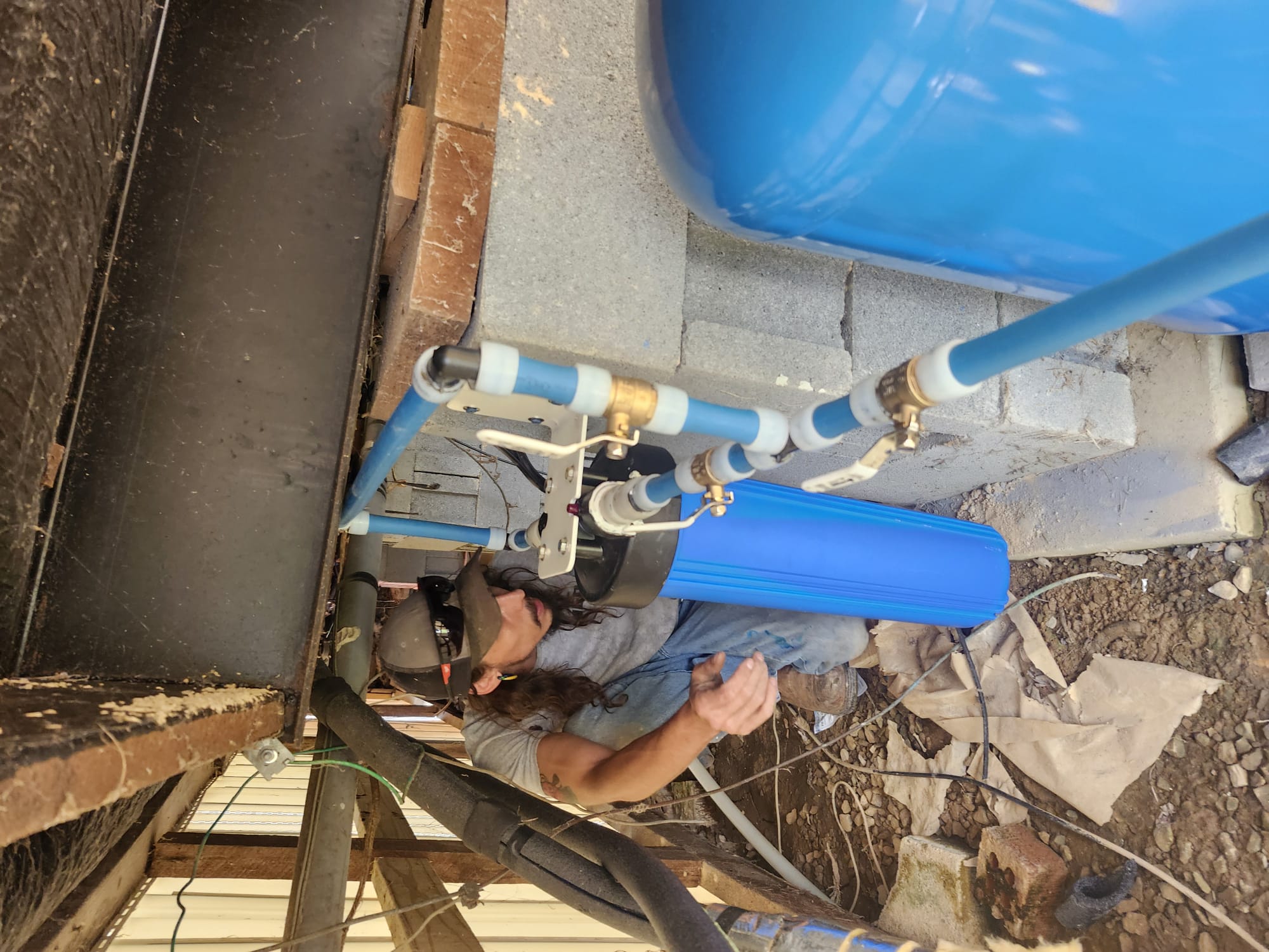 HEP Technician Installing Water Filter Housing