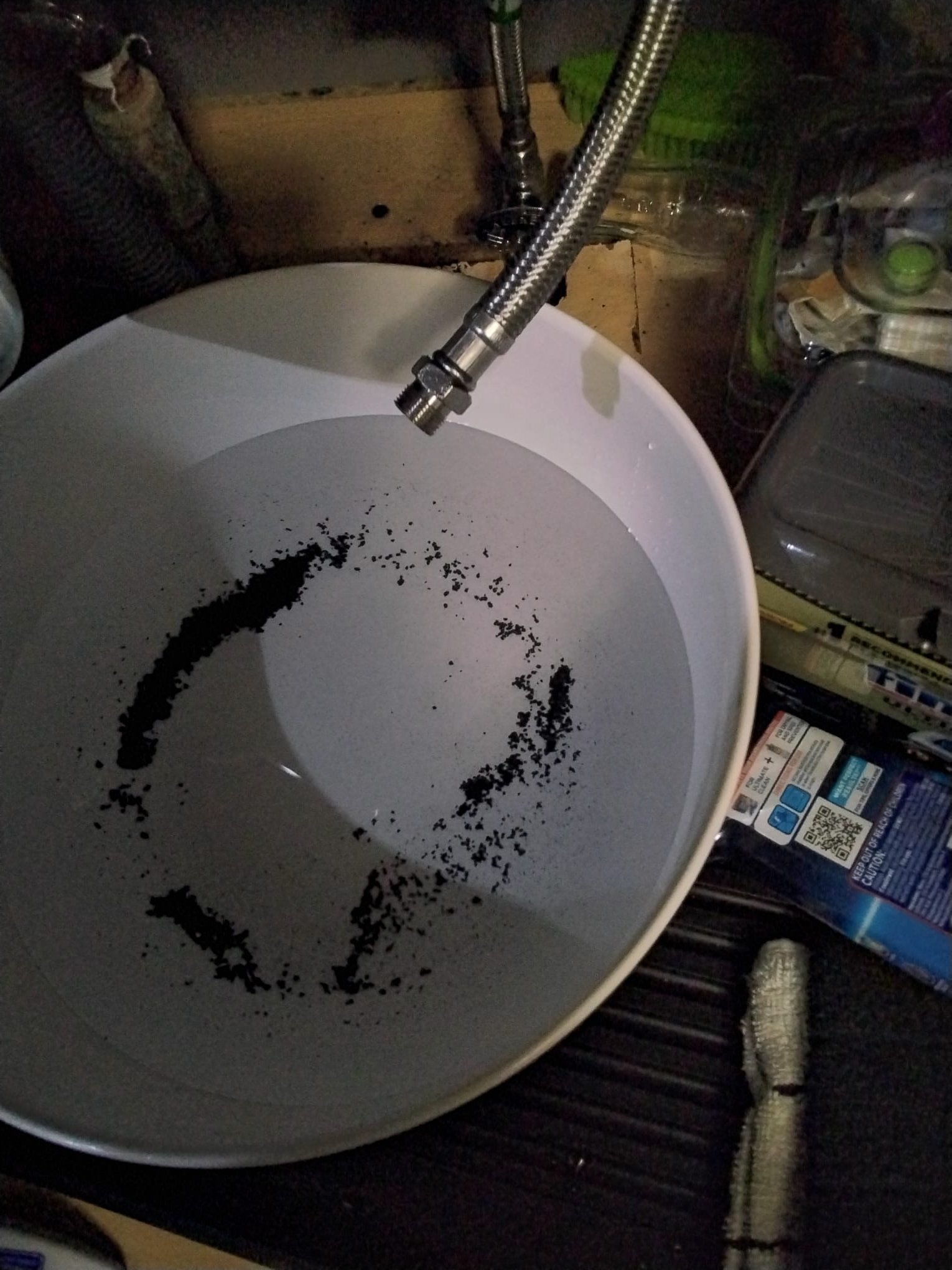 Flushing debris from water line under a sink