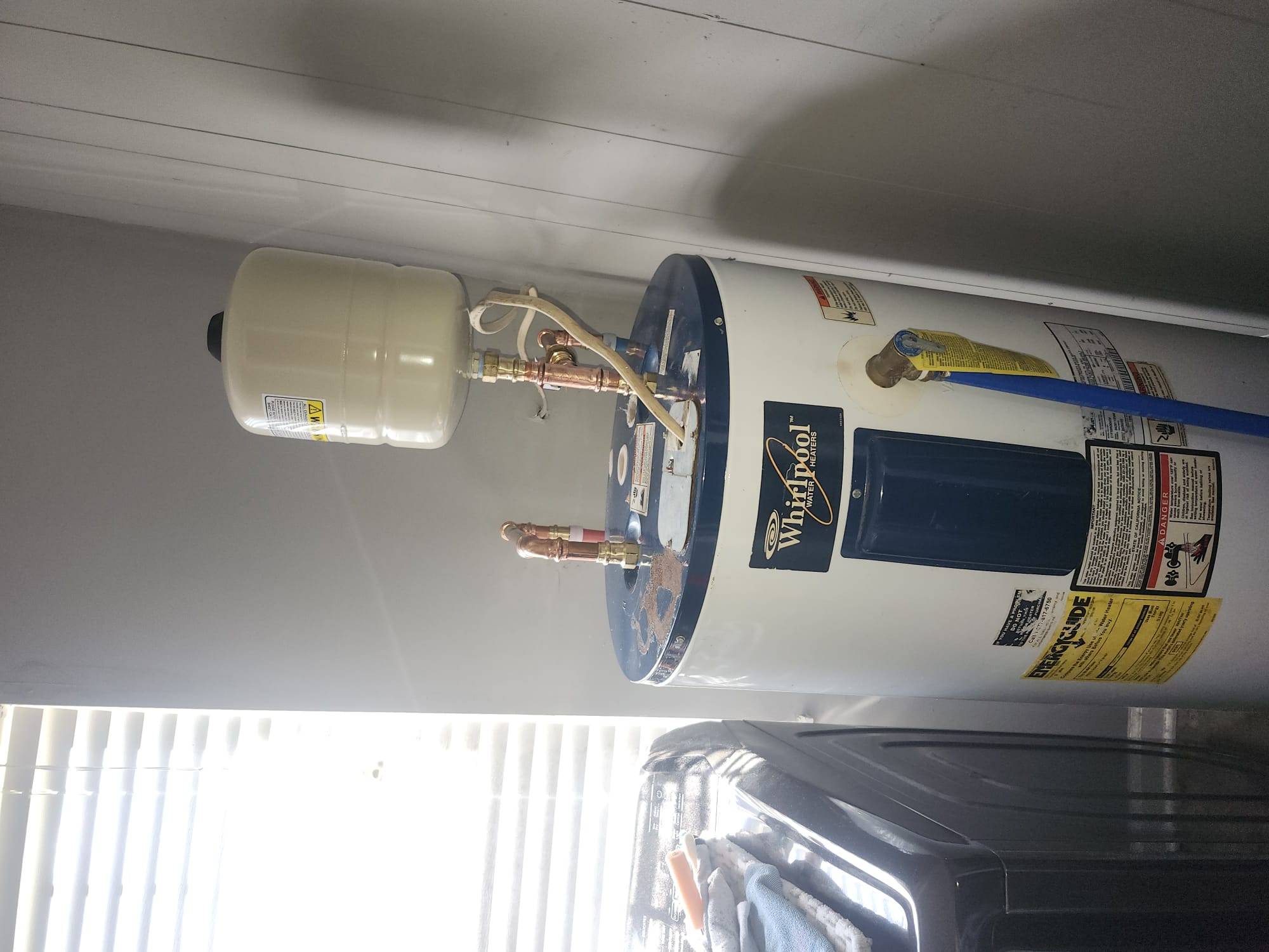 Water heater with newly installed expansion tank and piping