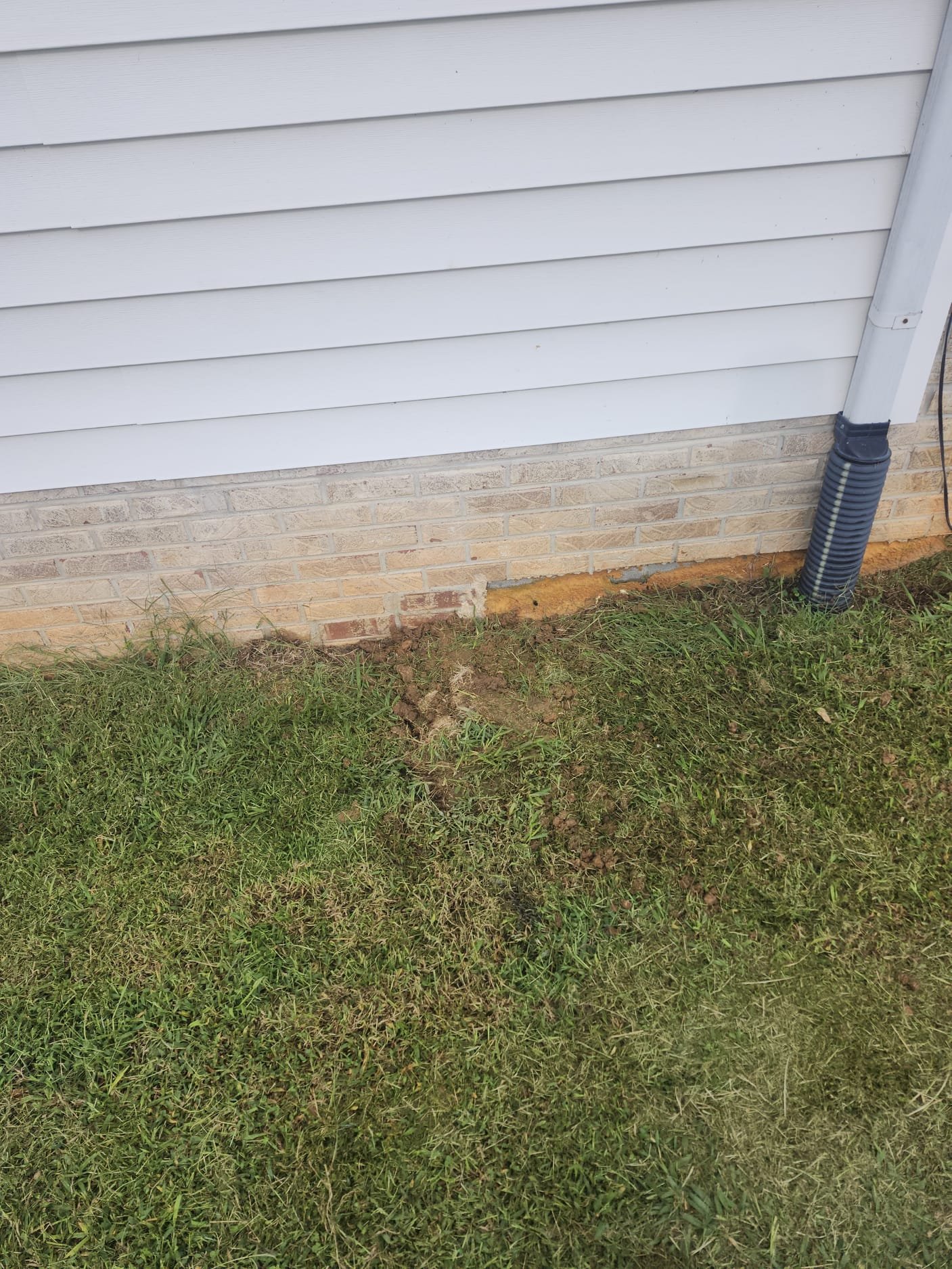 Finished Job: Ground restored with proper drainage away from foundation