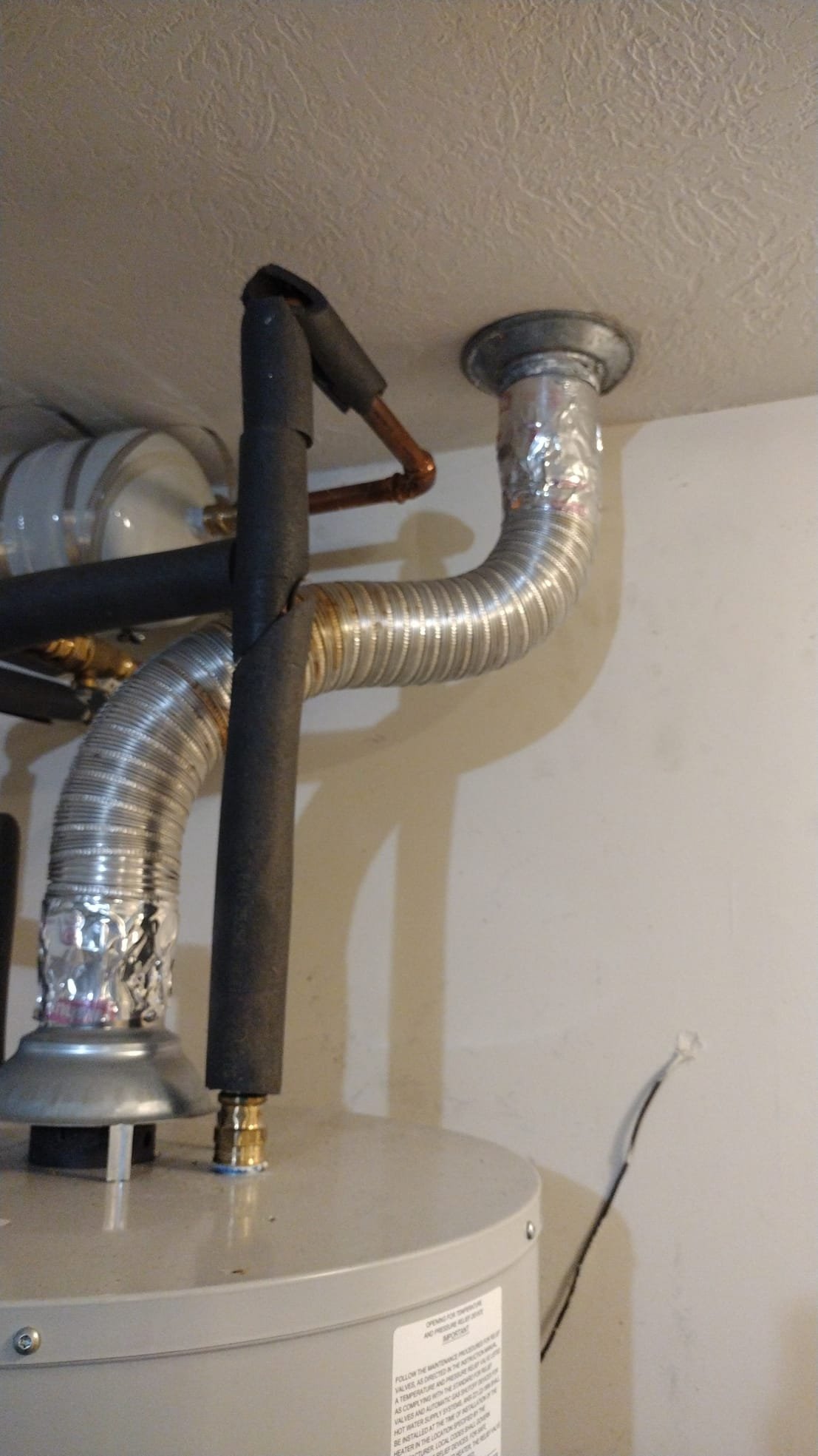 New flexible metal vent pipe, clean and properly secured