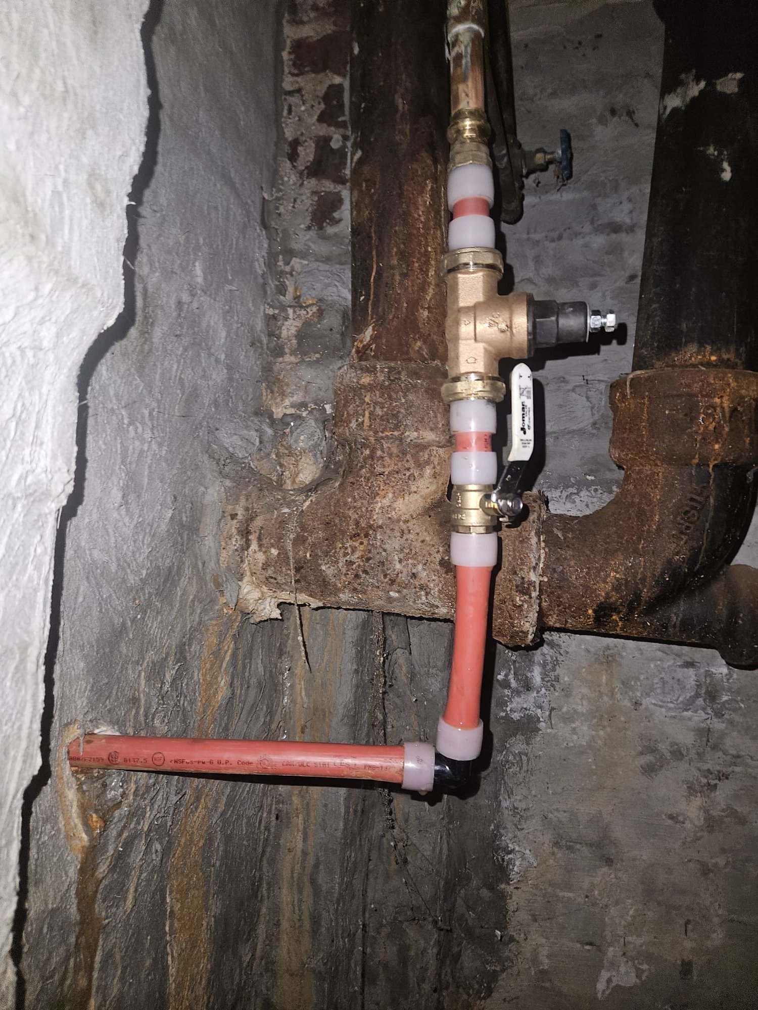 New red PEX pipes and brass valve assembly