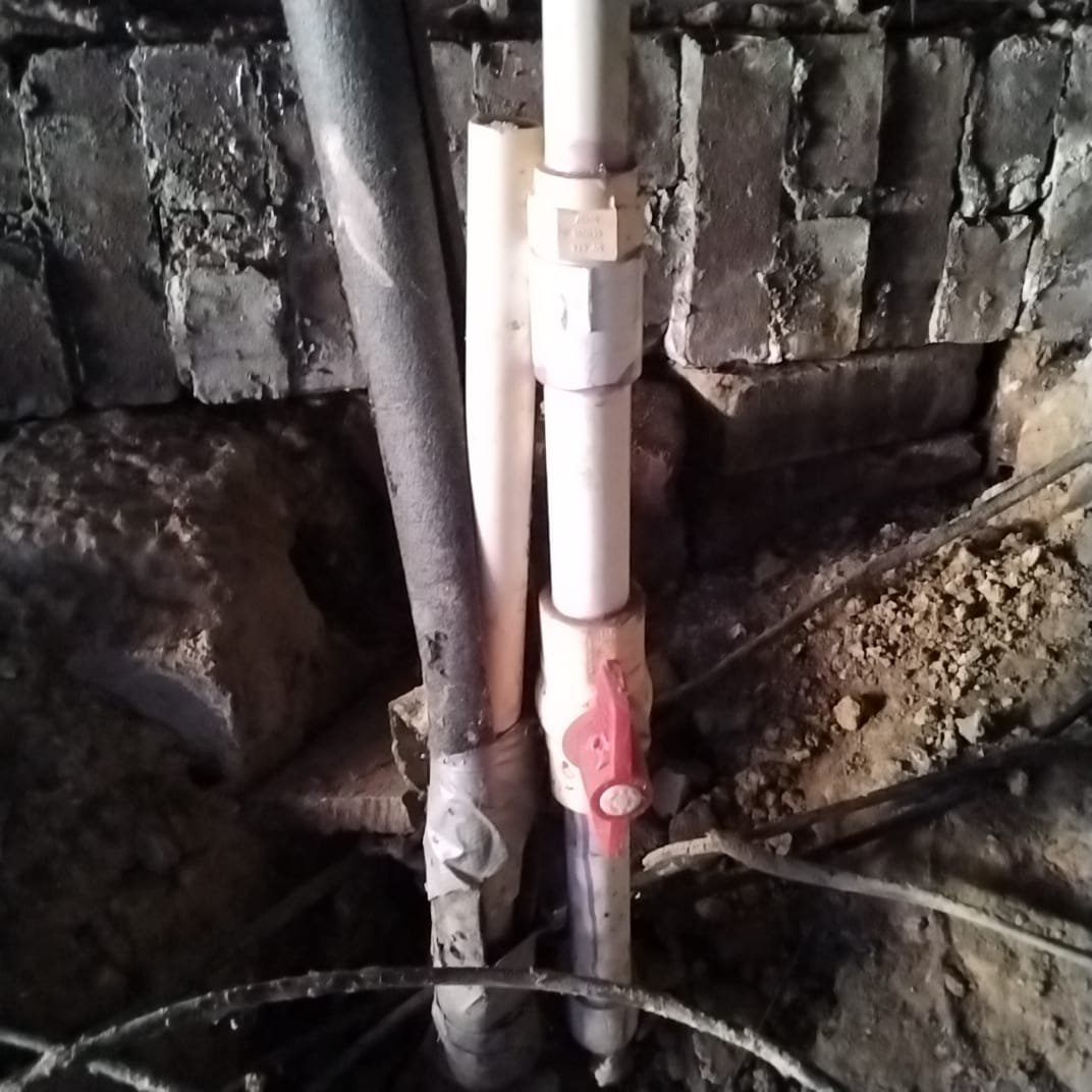 New PVC pipe with ball valve and check valve installed