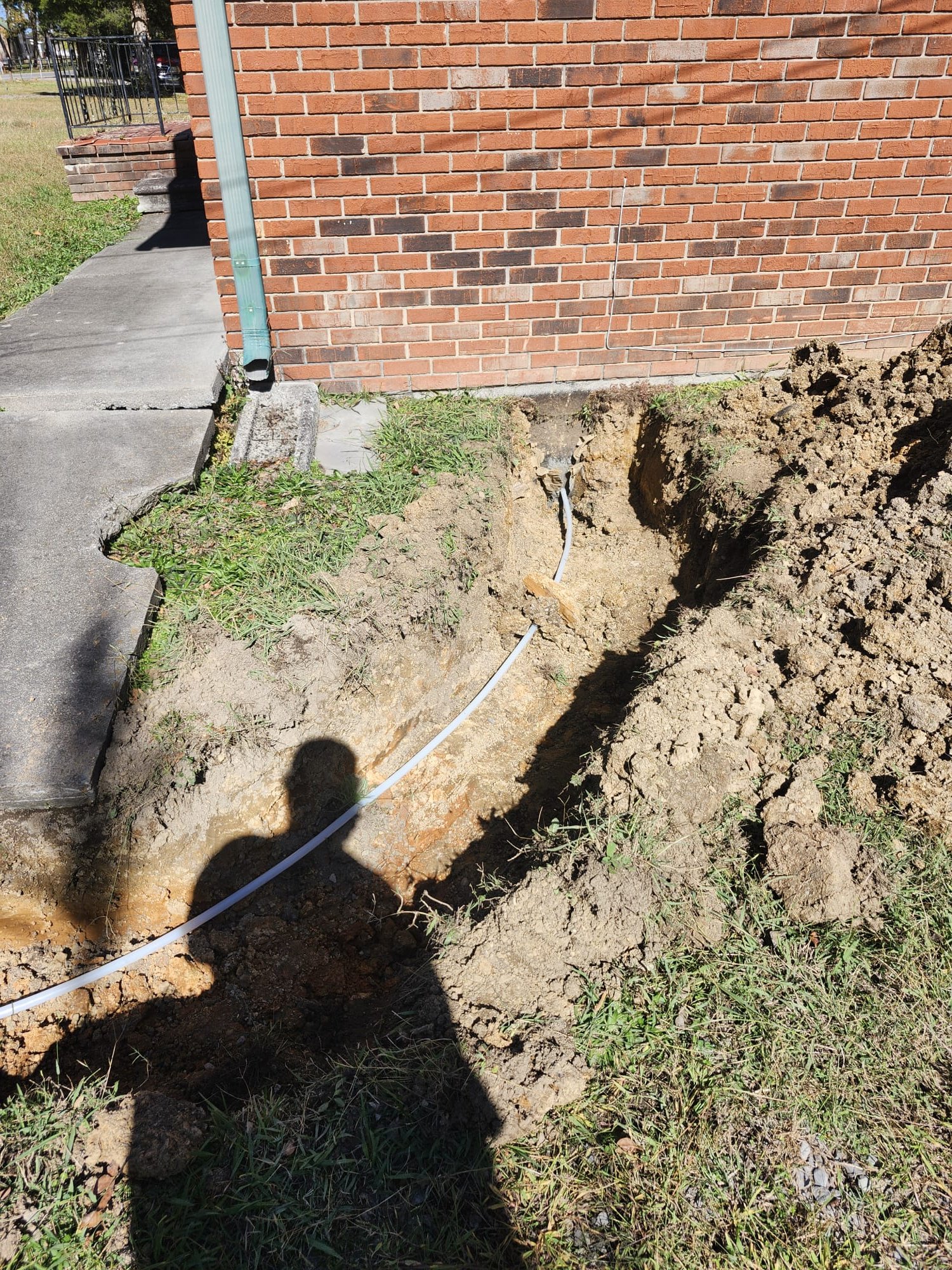 Trench showing new water line from meter to foundation