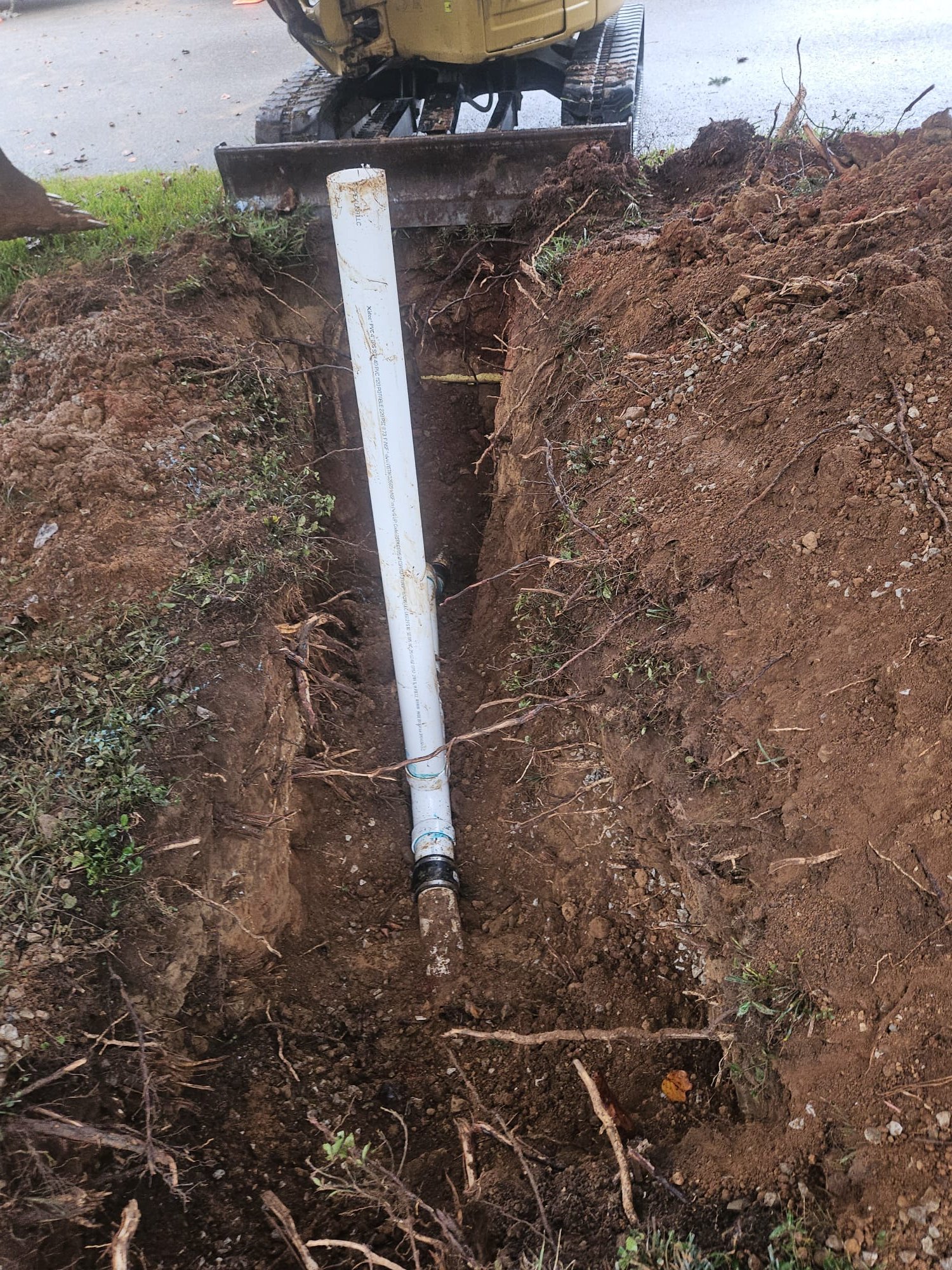 Newly installed PVC section with a sturdy rubber coupling