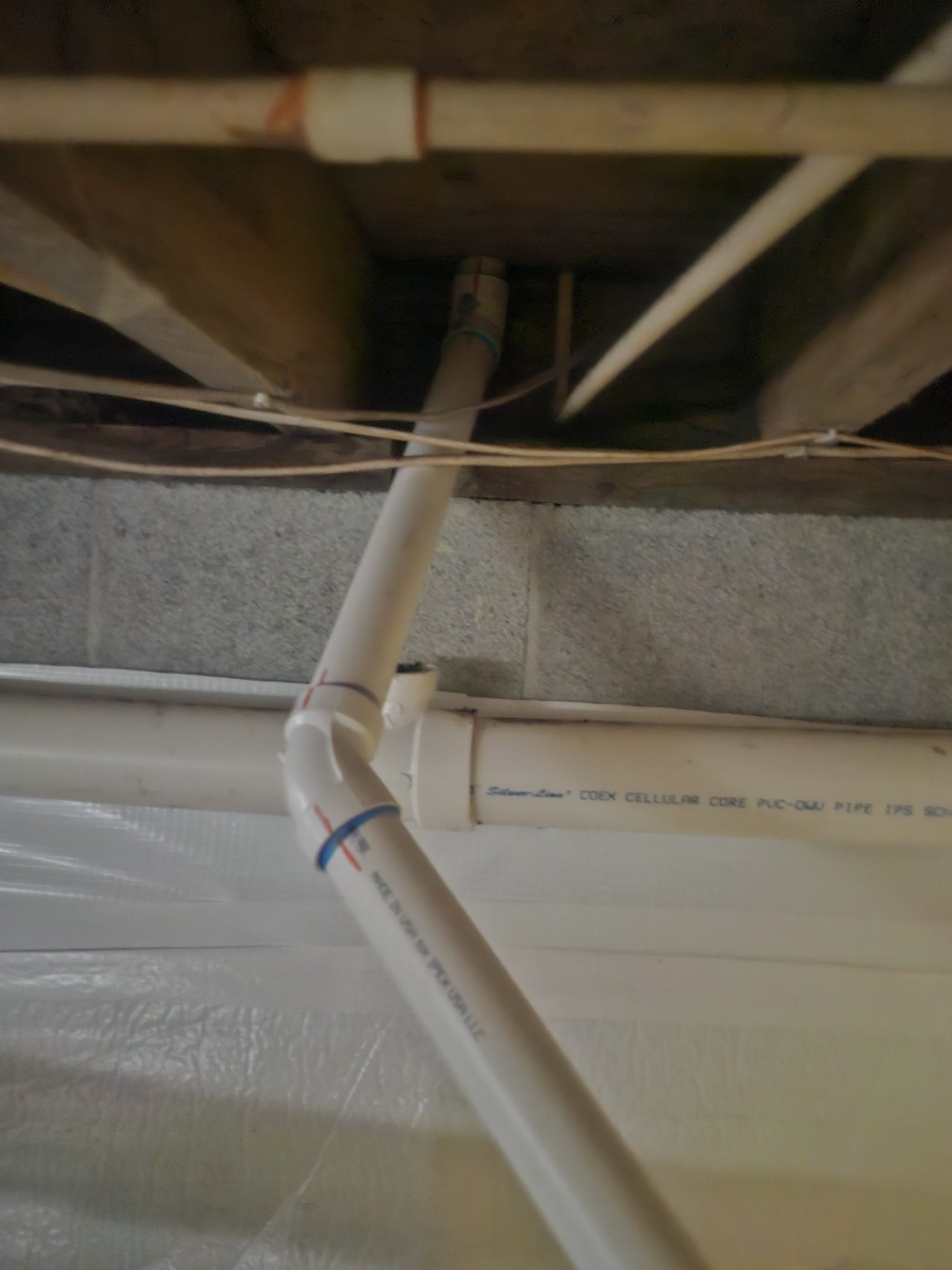 Well organized PVC pipes with clean fittings after professional service