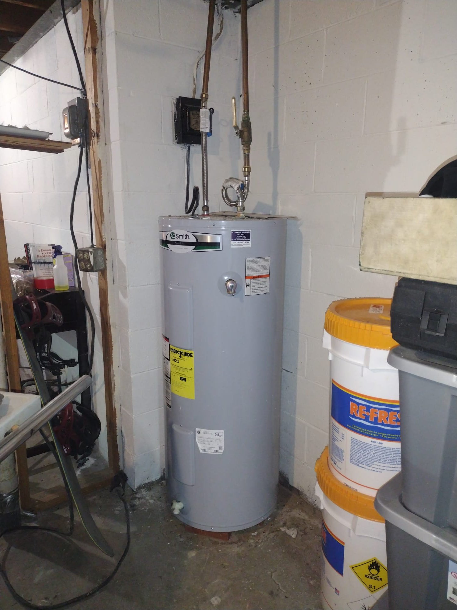 New water heater installed in a clean utility room