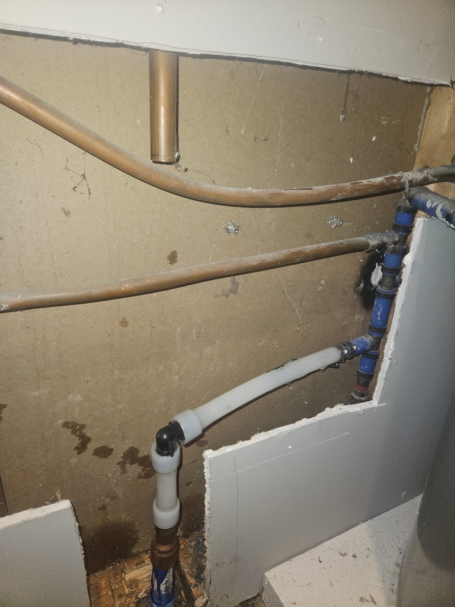 Interior View of Clean, Updated Pipes Behind the Wall