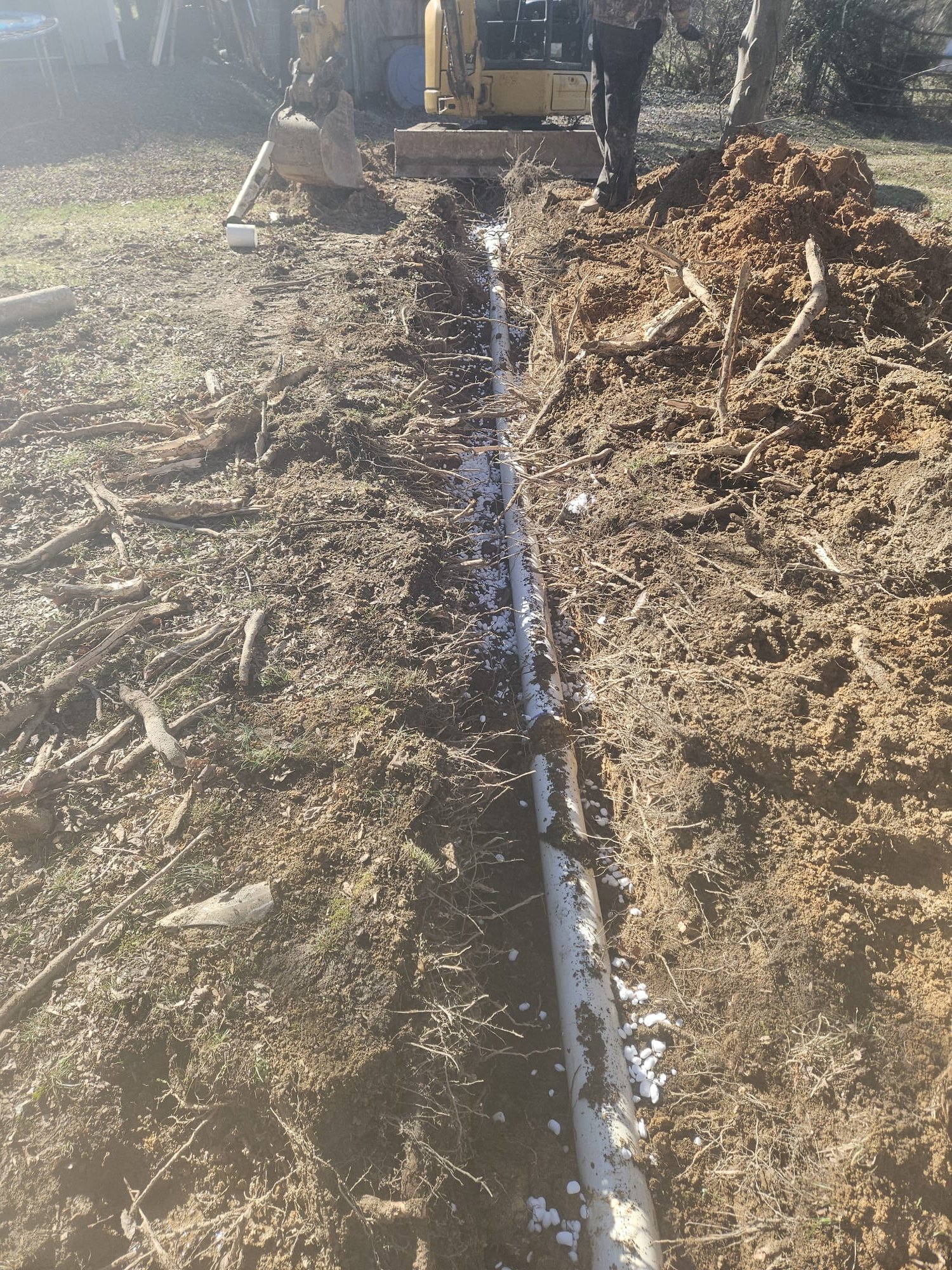 New PVC Pipe in Trench During Installation