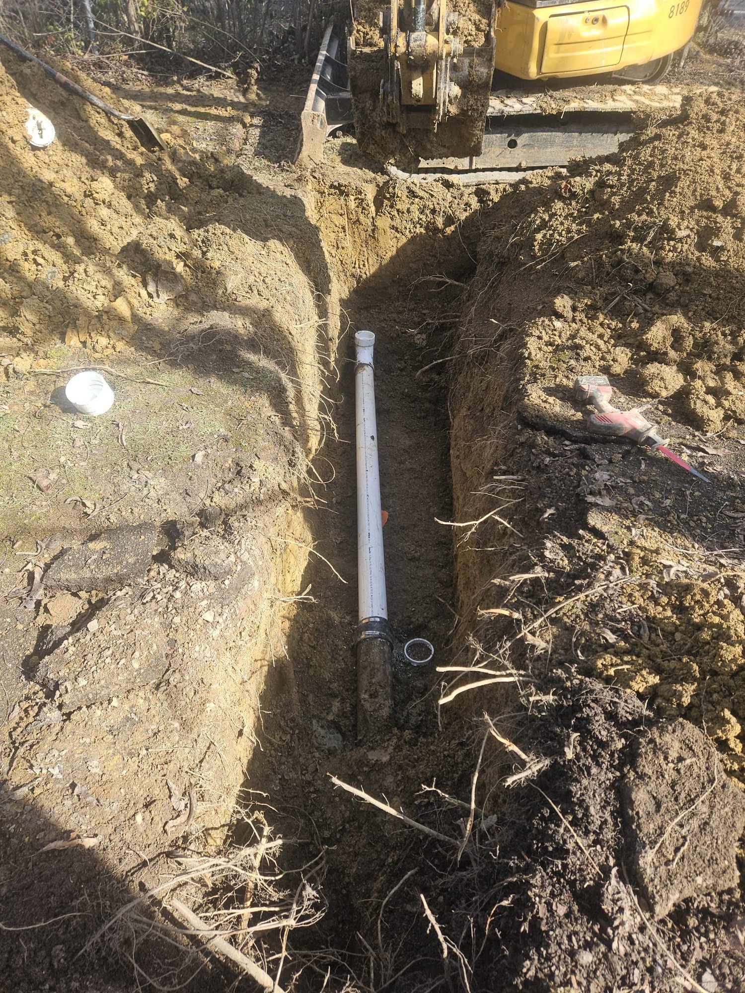 New PVC sewer line installed in trench