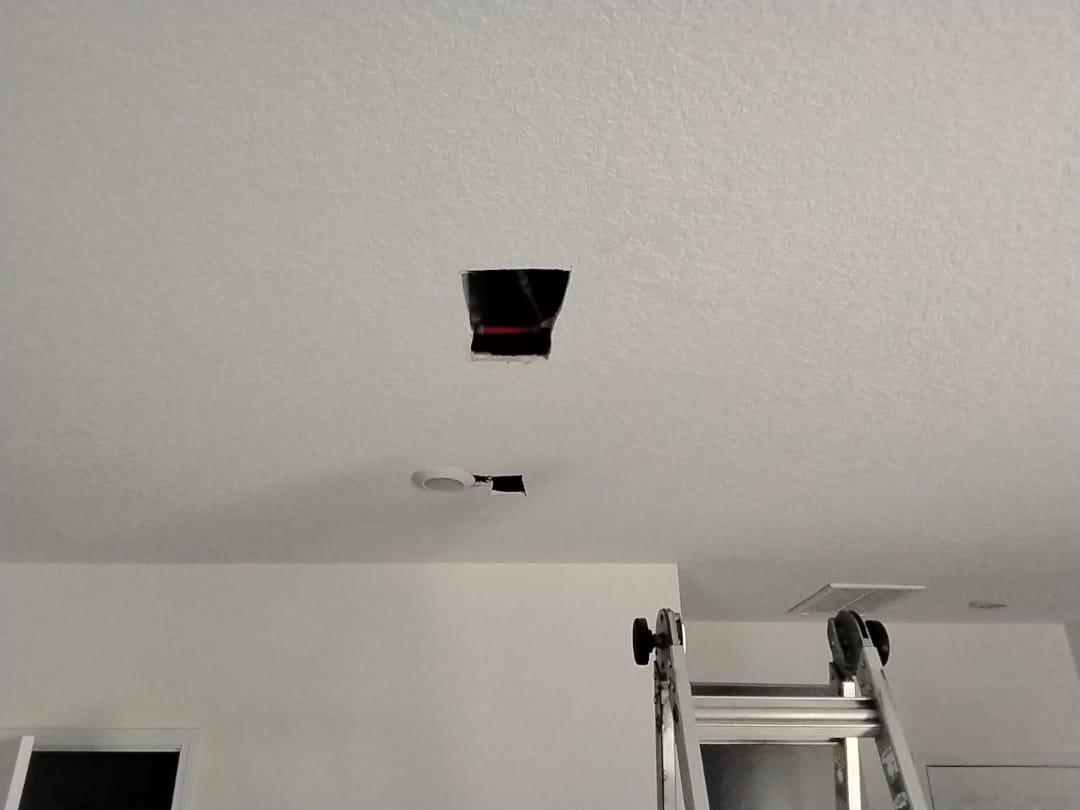 Ladder in place beneath ceiling cutouts