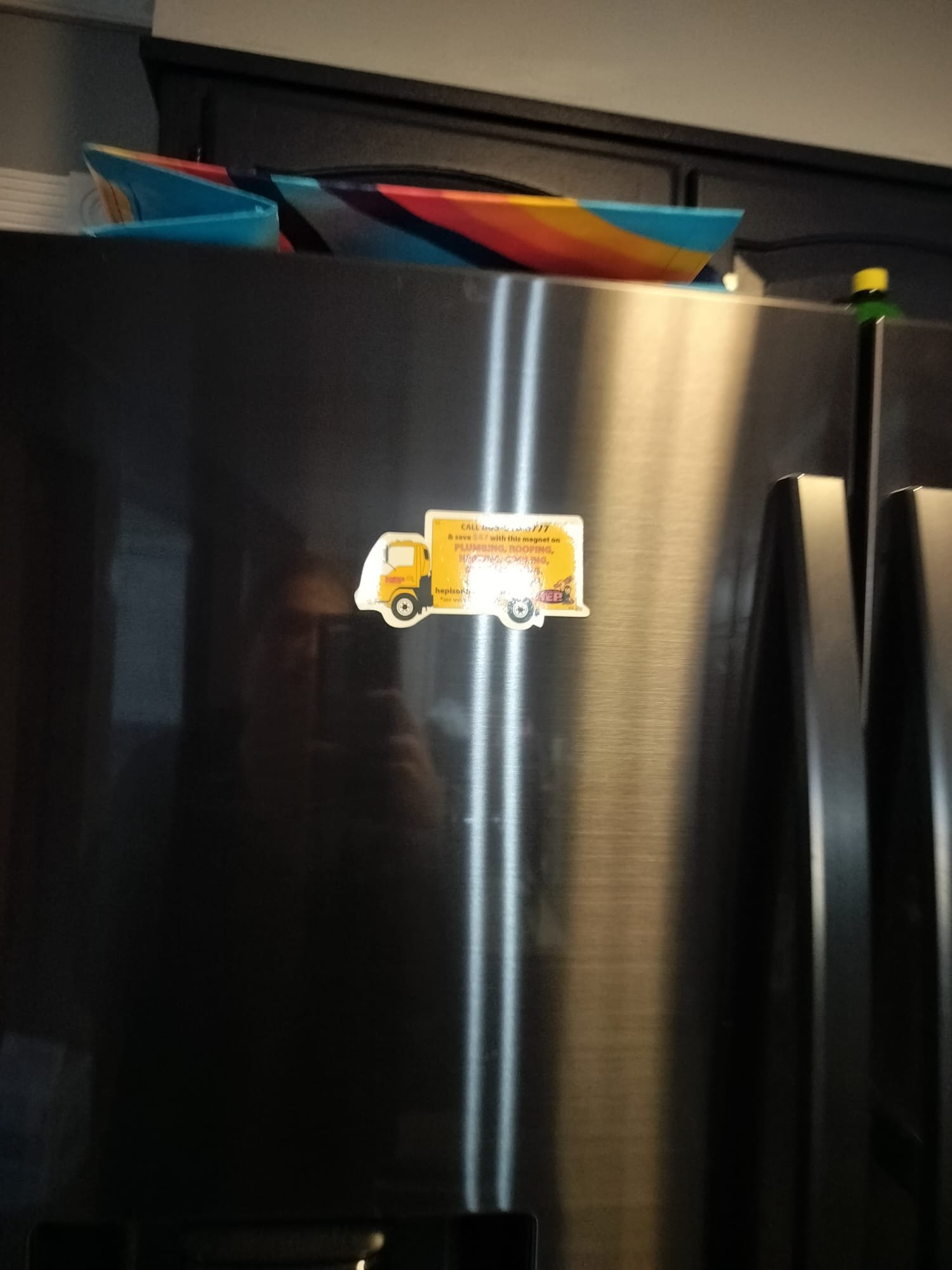 Refrigerator with service magnet