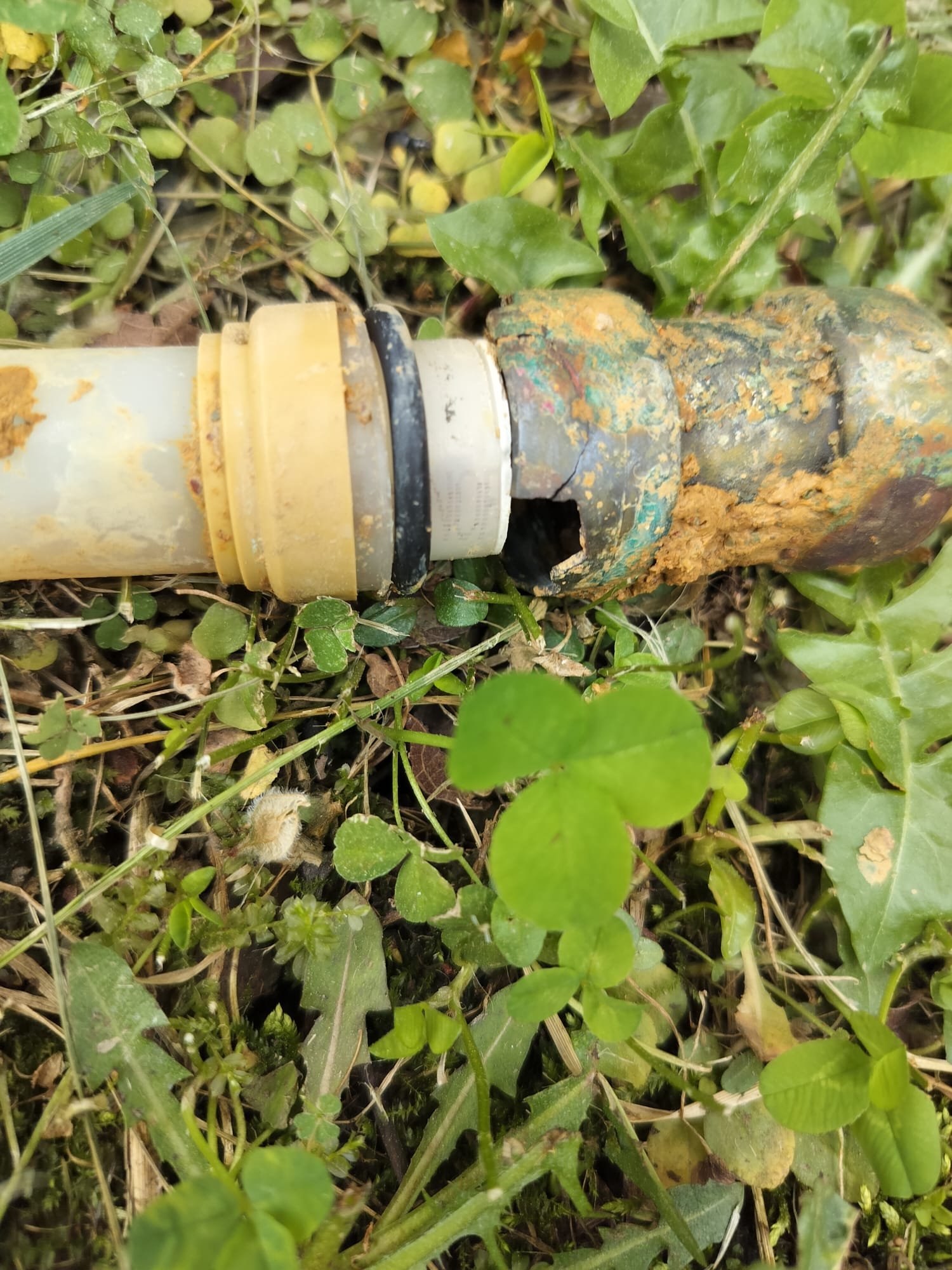 Corroded outdoor pipe fitting removed for repair