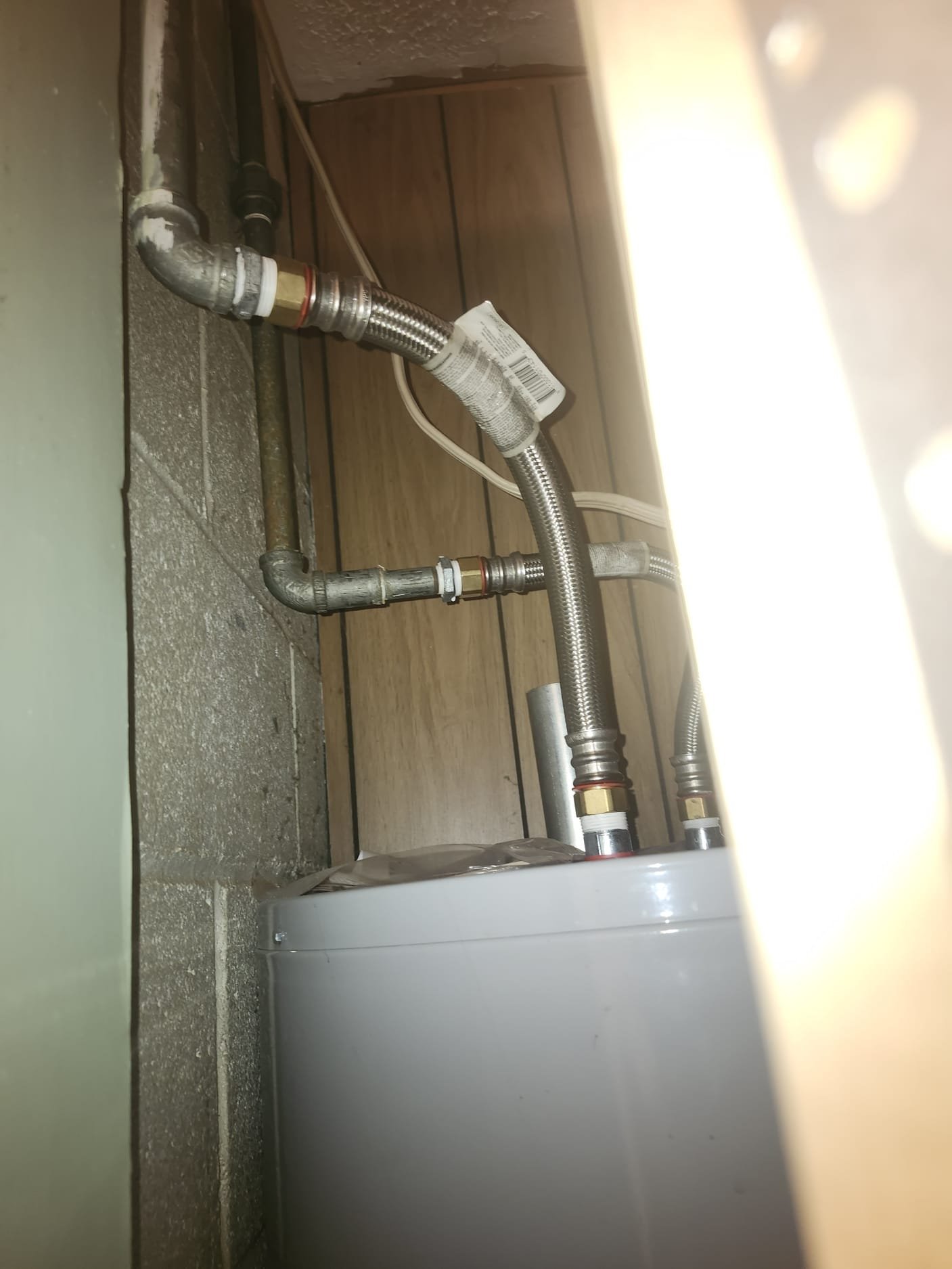 Top of water heater with new braided stainless hoses