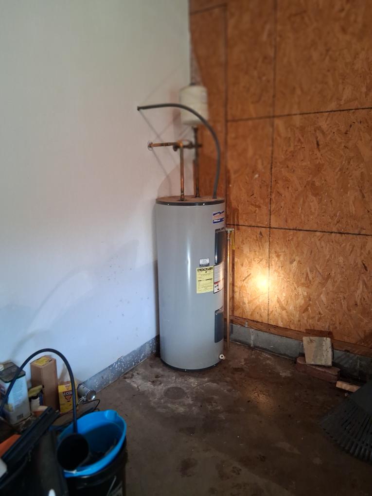 New water heater installed in a garage
