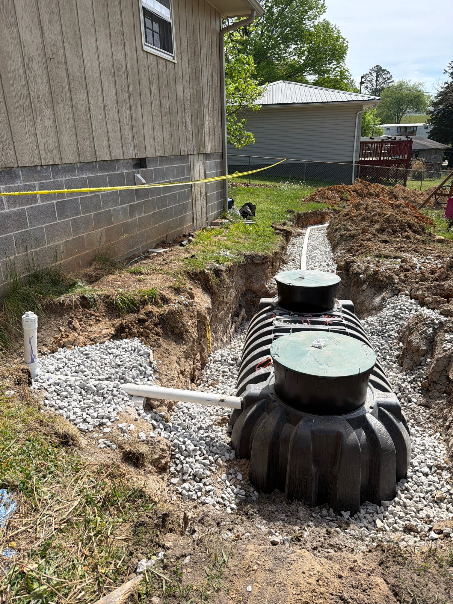 Septic tank installation next to the house with gravel bedding