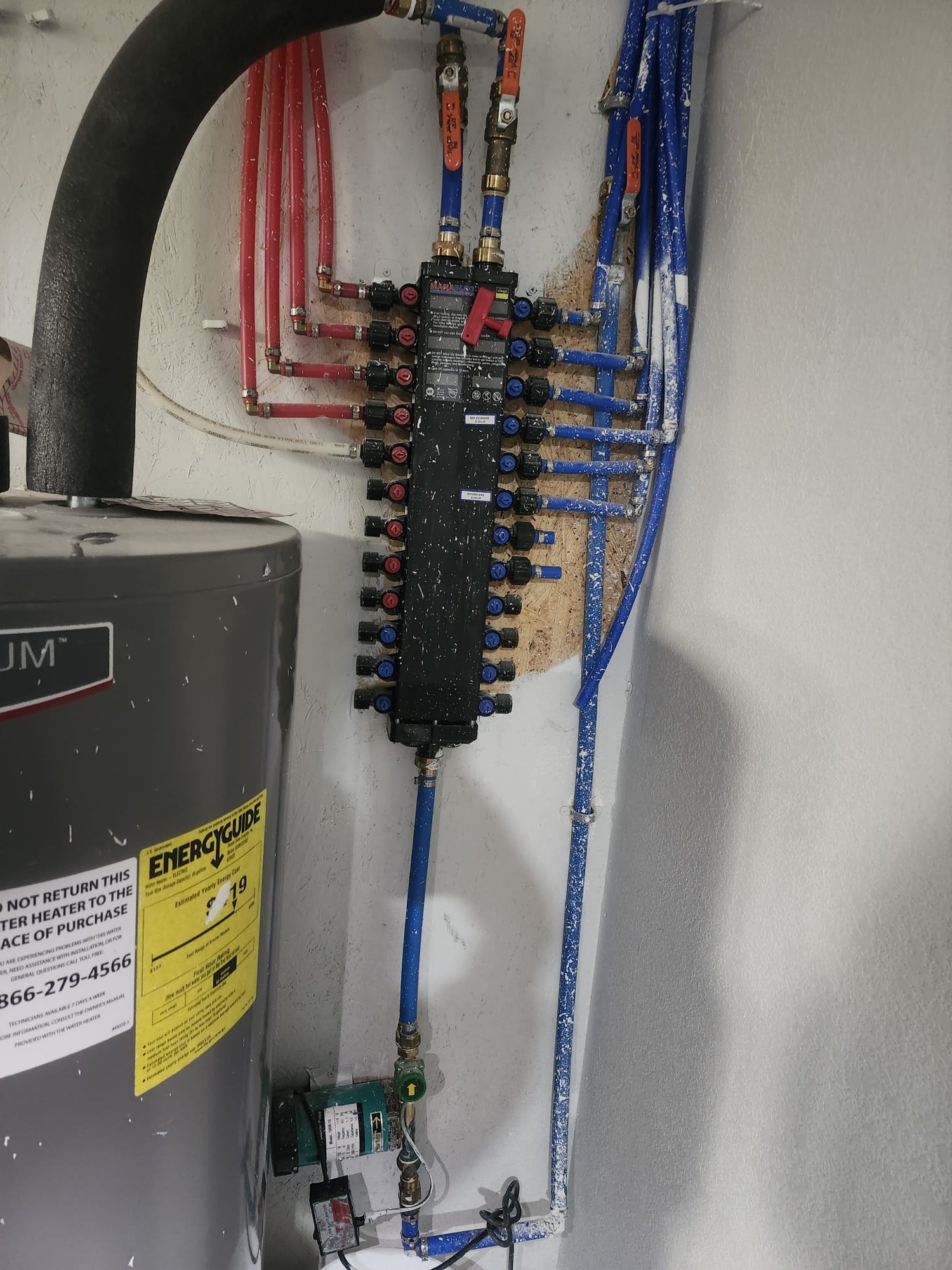 Modern plumbing manifold with individual shut-off valves for each line