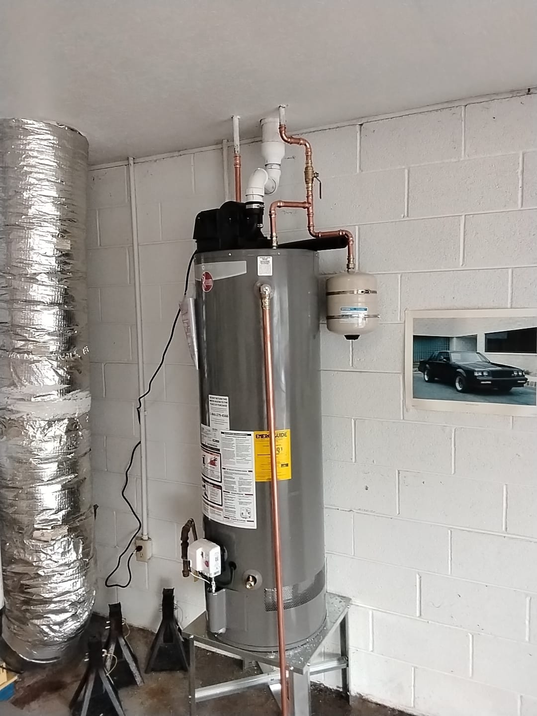 Professional water heater installation with proper venting