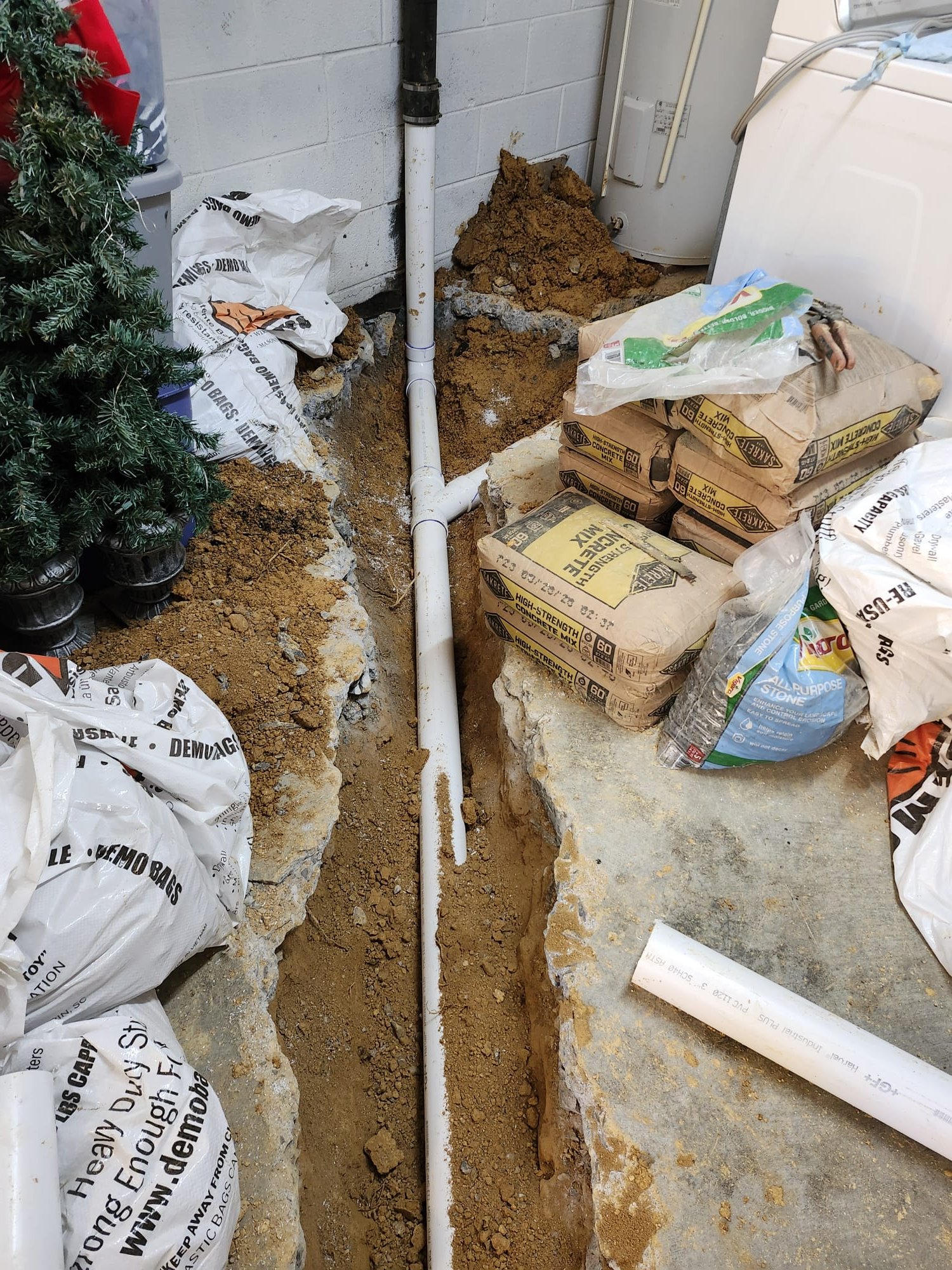 Clean PVC pipes ready for backfill beneath the floor slab.