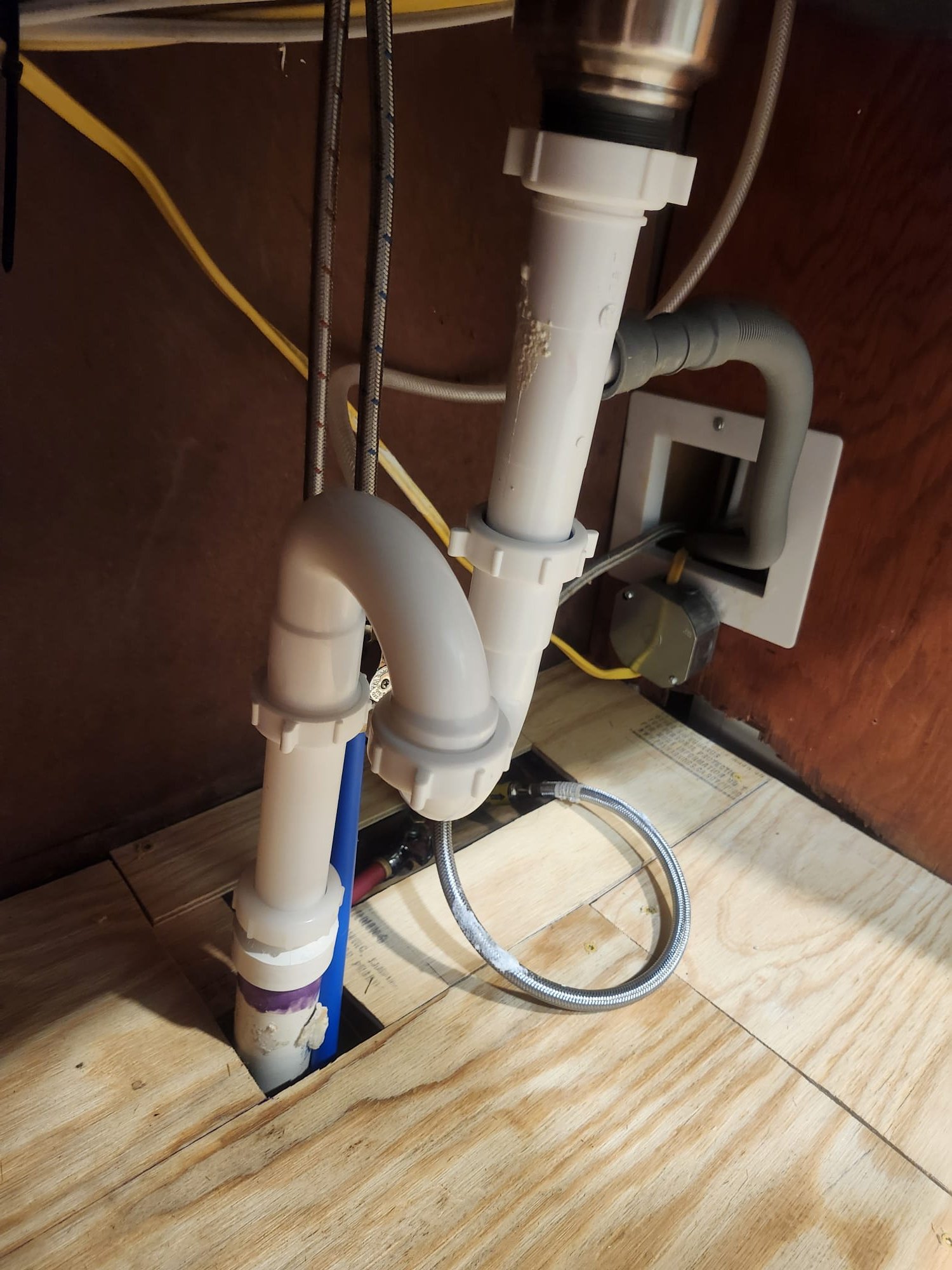 Freshly updated under-sink drain piping